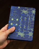 Genetics mini hardcover notebook by Cognitive Surplus, pictured in hand