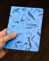 Birds mini hardcover notebook by Cognitive Surplus, pictured in hand