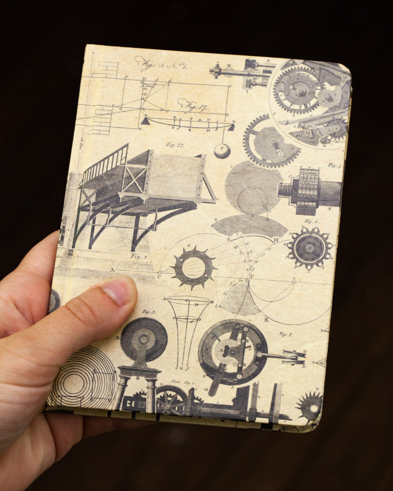 Engineering mini hardcover notebook by Cognitive Surplus, pictured in hand